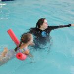 girl kicking during swim lesson in knoxville tn.JPG